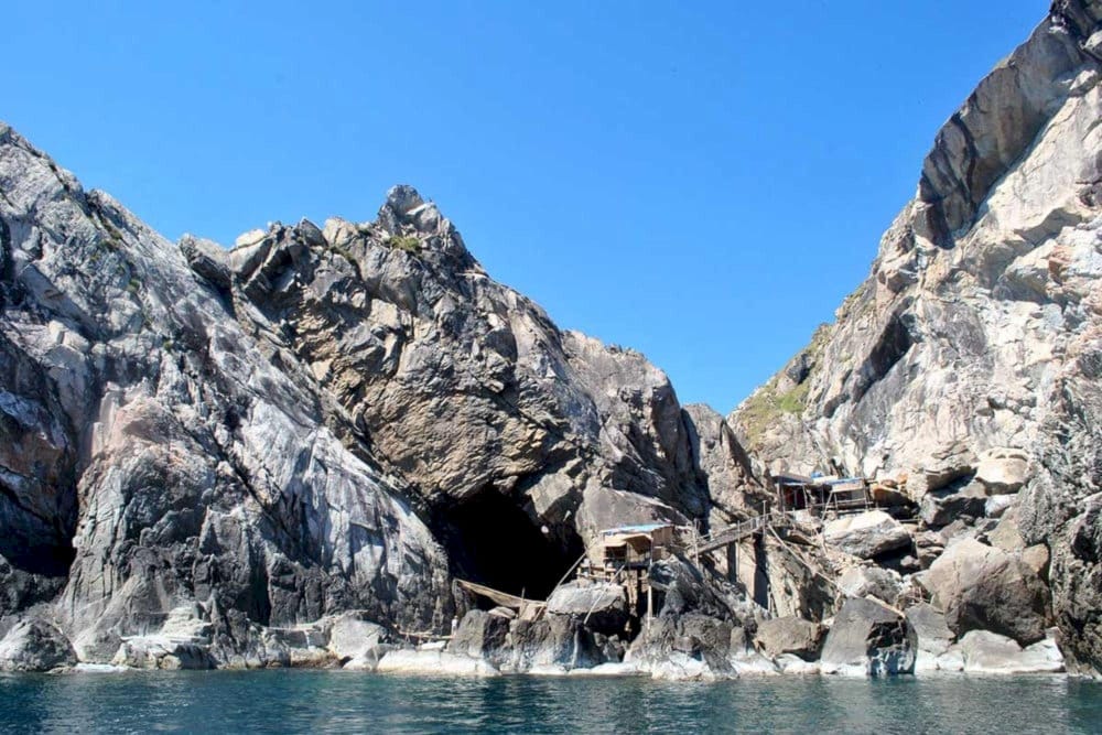 Nest Island is famous for its cliffs and bird nests, hosting the annual Yen Nest Festival to celebrate traditional harvesting